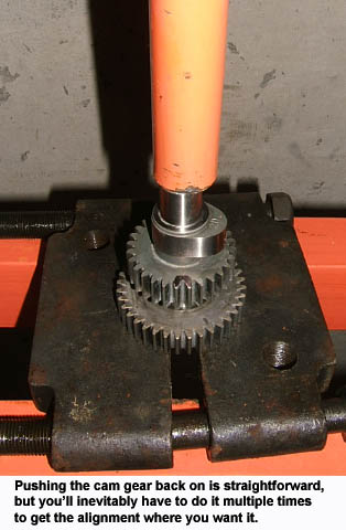 Using a press to push a Sportster cam into it's drive gear